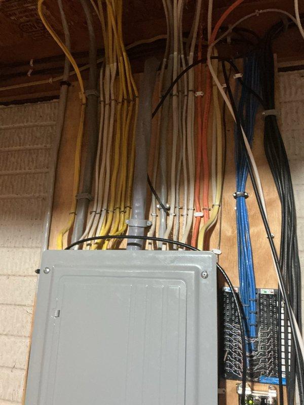 Completed electrical corrections following failed inspection on Kohler generator installation. Properly labeled disconnect per NEC 230.85, corrected neutral wire terminations to one wire per terminal per NEC 408.41, installed dedicated ground bar for equipment grounding conductors, and secured service entrance cable above the electrical panel to meet code requirements.