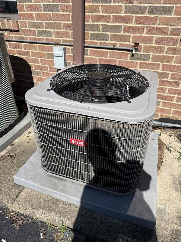 Completed standard AC tune-up on outdoor condensing unit. Upon inspection, found heavy accumulation of dirt, dust, and debris on condenser coil fins and protective grille, which was restricting airflow and reducing system efficiency. Cleaned condenser coils and removed environmental debris buildup from heat exchanger fins. Verified refrigerant lines and electrical connections secure. Unit operating within normal parameters upon completion.