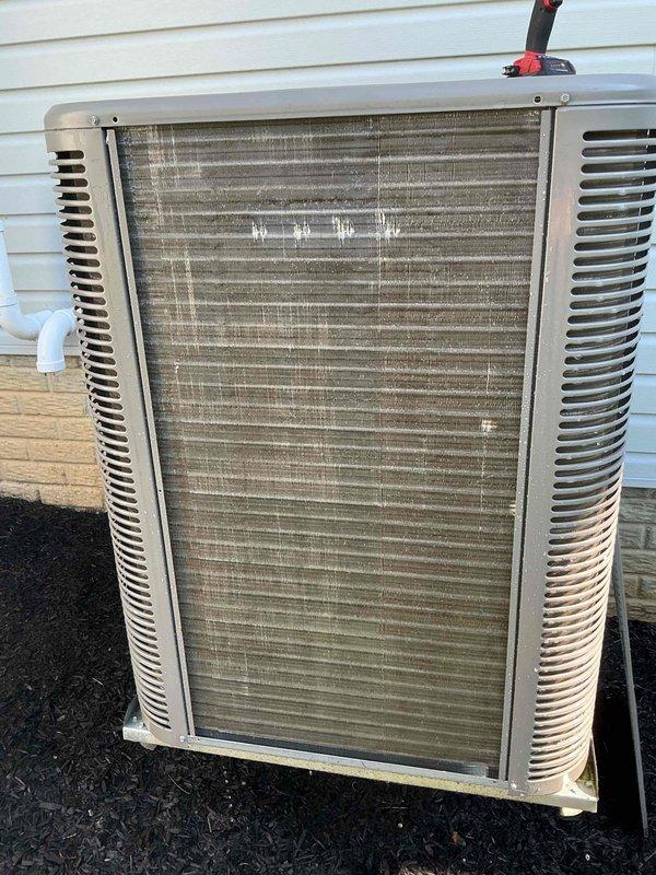 Completed MVP recurring cooling maintenance visit on residential air conditioning system. Performed comprehensive inspection of outdoor condenser unit, documented equipment condition with photographs showing significant dirt and debris accumulation on heat exchanger coil fins requiring attention. Unit operational and accessible on exterior concrete pad with proper drainage and clearances maintained.