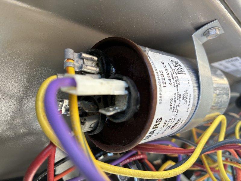 Completed preventative maintenance inspection on 7-year-old rooftop air conditioning unit. Accessed unit using tall ladder, removed access panel, and performed comprehensive system evaluation. Inspected capacitor, electrical connections, and wiring harness - all components found to be in functional condition with connections intact. Documented system condition with photos for maintenance records.