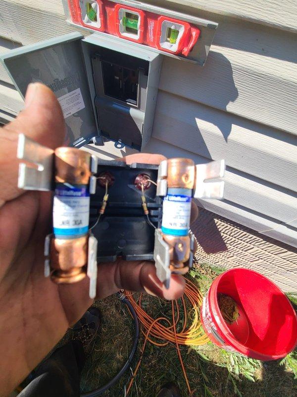 Completed installation of outdoor A/C condenser unit and evaporator coil system. Connected refrigerant line sets with proper insulation, installed electrical disconnect box with level mounting on exterior wall, and routed copper piping and electrical conduits from condenser to indoor coil. Verified all connections secure and system properly positioned on pad with adequate clearance for airflow.