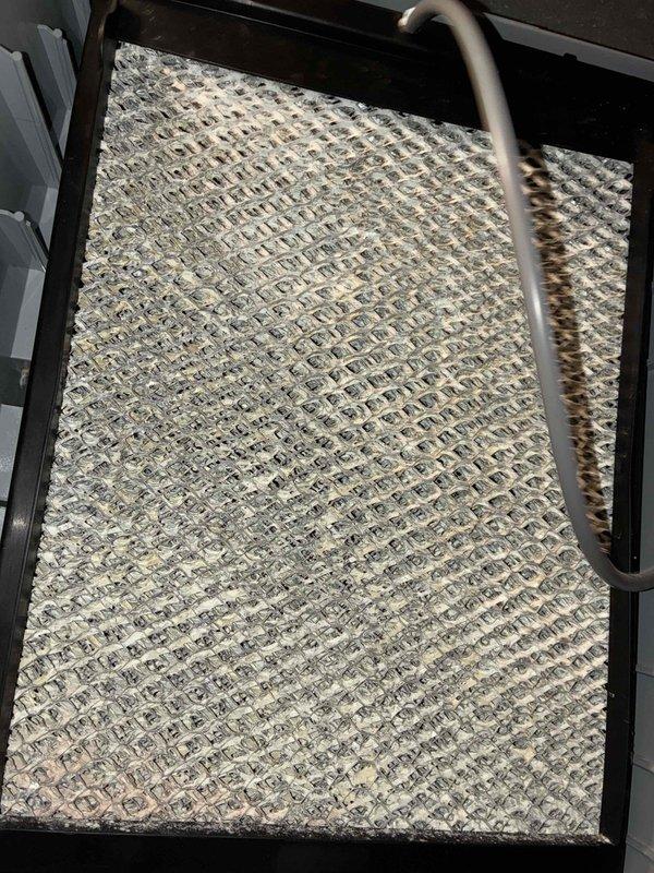 Completed MVP recurring cooling maintenance visit. Inspected evaporator coil and confirmed operational status with minor dust accumulation noted on fins; no immediate cleaning required at this time. Verified Aprilaire 600 Series humidifier installation and connections, confirming all components functioning properly with secure electrical and plumbing connections intact.