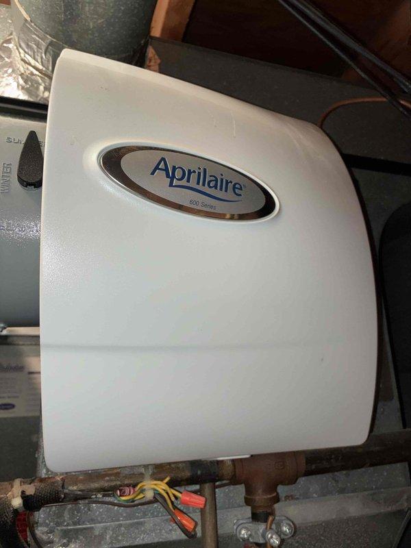 Completed MVP recurring cooling maintenance visit. Inspected evaporator coil and confirmed operational status with minor dust accumulation noted on fins; no immediate cleaning required at this time. Verified Aprilaire 600 Series humidifier installation and connections, confirming all components functioning properly with secure electrical and plumbing connections intact.