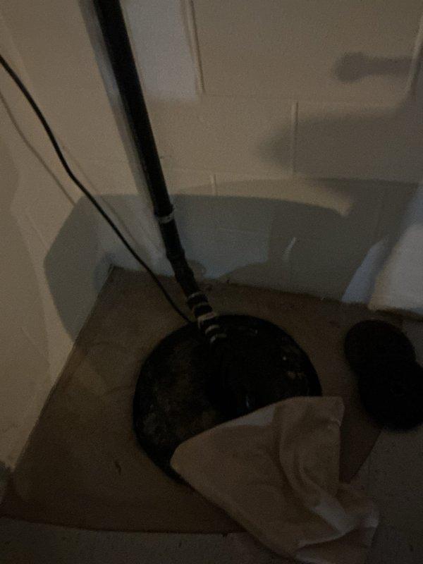 Responded to service call for two leaking outdoor spigots on 30-year-old residential property. Upon inspection, identified active leaks at both exterior hose bibs. Accessed interior plumbing connections through utility closet and crawl space area to assess supply lines and shut-off valves. Documented existing conditions showing black supply piping and mounting configuration in confined mechanical space. Completed diagnostic evaluation of both spigot assemblies and associated plumbing infrastructure to determine repair requirements.