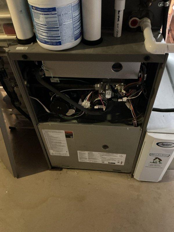 Completed AC tune-up service including comprehensive system inspection and performance verification. Accessed furnace cabinet to inspect internal components, electrical connections, blower motor assembly, and control mechanisms. All wiring connections examined and found secure. Installed complimentary carbon monoxide detector as part of seasonal maintenance package. System operating within normal parameters upon completion.