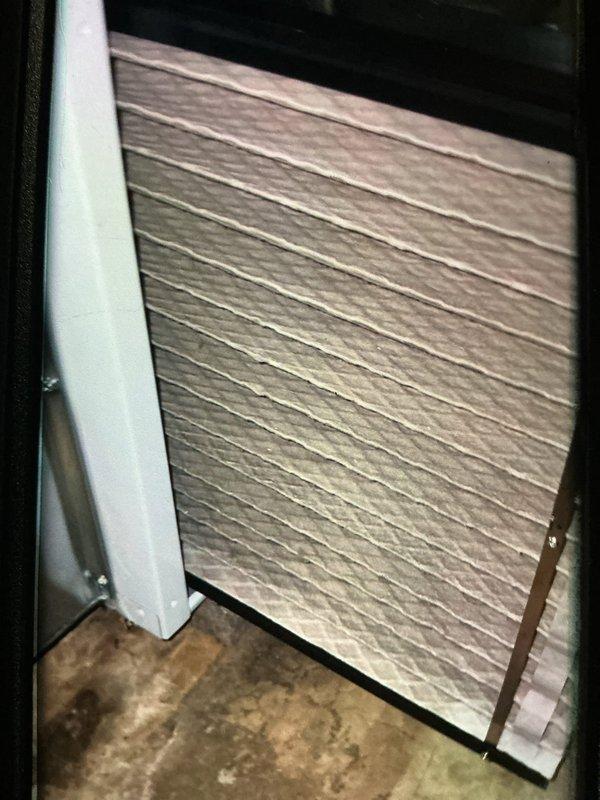 Completed MVP cooling maintenance visit on 3-year-old system. Inspected and replaced two 40A, 250V AC electrical fuses (TR40R) in outdoor disconnect panel. Examined air filter in air handler compartment, noting pleated media filter with light brown coloration indicating moderate dust accumulation. All electrical components and filter housing inspected for proper operation and secure mounting.