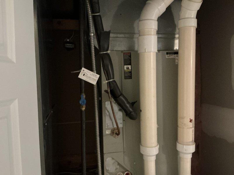 Conducted comprehensive HVAC system evaluation for replacement estimate on 16-year-old York furnace installation. Assessed existing equipment configuration including furnace unit, PVC drainage and ventilation systems, ductwork connections, electrical components, and condensate management setup in basement utility space. Documented current system condition through photographic records and provided customer with replacement options for aging heating system.