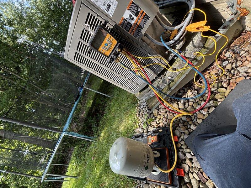 Completed preventive maintenance service on a 6-year-old residential air conditioning system for enrolled maintenance plan customer. Performed comprehensive inspection of indoor air handler unit, confirming clean pleated air filter in place with proper airflow. Connected manifold gauge set to outdoor condensing unit to evaluate system refrigerant pressures and verify proper charge levels. All components operating within normal parameters with no deficiencies noted during inspection.