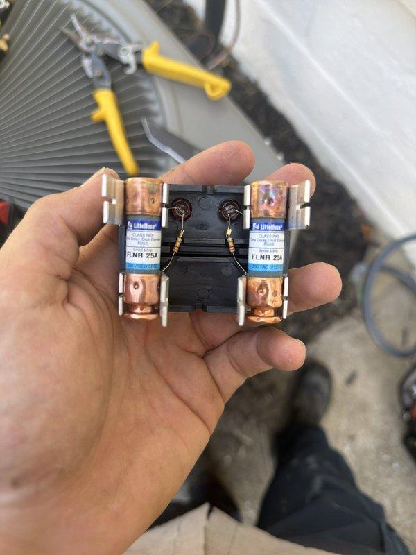 Completed first-time installation of new Lennox air conditioning condensing unit with matching evaporator coil system. Installed outdoor unit on concrete pad with proper electrical connections including disconnect box, junction box, and weather-resistant components, verified FLNR 254 CLASS RK5 Littelfuse fuses properly seated in disconnect, and established all required conduit runs per code requirements.