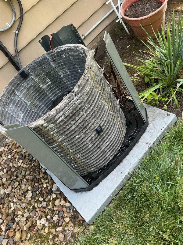 Performed routine cooling maintenance on 10-year-old Trane air conditioning system. Conducted comprehensive AC tune-up including inspection of condenser unit, which showed significant accumulation of dirt, debris, and organic matter on coil fins requiring cleaning. Verified system operational status, cleaned condenser coils to remove environmental contaminants and improve heat transfer efficiency, and completed all standard maintenance procedures to ensure optimal system performance for the cooling season.