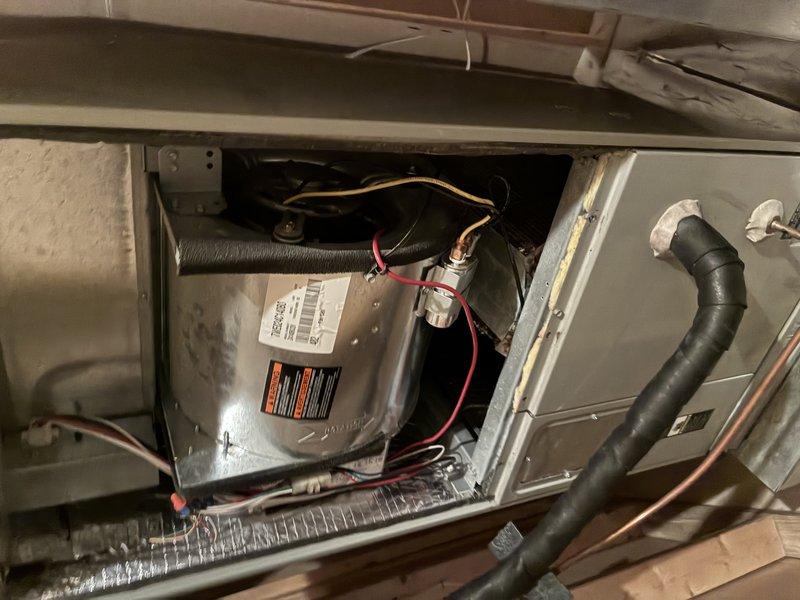 Completed comprehensive tune-up on 20-year-old residential air conditioning system, including outdoor condensing unit and indoor air handler located on lower level. Performed full system inspection with detailed documentation of blower motor assembly, copper windings, refrigerant lines, and electrical connections. Replaced air filter and verified proper operation of all mechanical and electrical components within the HVAC system.