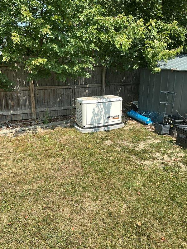 Disconnected and temporarily removed Generac standby generator to accommodate home addition construction. Capped natural gas line at interior connection point, removed exterior gas piping to generator unit, and disconnected electrical whip from transfer switch to generator. Generator and concrete pad relocated to back corner of property for storage during remodel phase, with future reinstallation and relocation to be quoted upon completion of addition.
