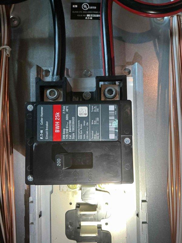 Performed electrical estimate for generator installation in unfinished basement utility space. Assessed existing electrical infrastructure including 200-amp Eaton BMH125K circuit breaker panel with proper UL certification and busbar configuration. Documented site conditions including exposed ceiling joists, existing plumbing and HVAC systems, concrete block walls, and available floor space for equipment placement. Evaluated electrical service capacity and panel accessibility for generator transfer switch integration. Photographed electrical panel specifications, existing conduit routing, and workspace layout to prepare comprehensive installation estimate.