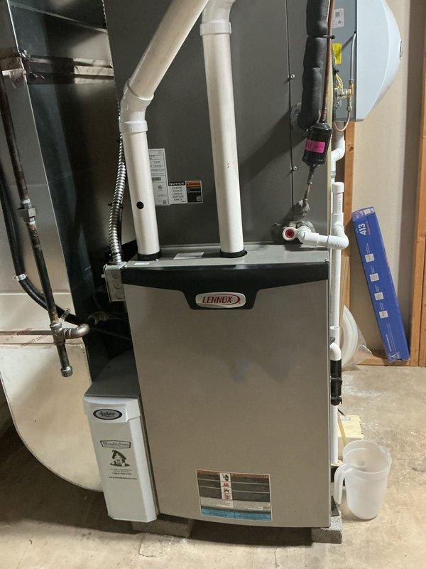 Completed routine maintenance visit on 4-year-old Lennox cooling system for MVP customer. Performed comprehensive inspection of indoor air handler unit located in basement utility area and outdoor condensing unit. Checked refrigerant levels, electrical connections, and operational performance of all system components. Noted vegetation growth around outdoor unit base that may require future clearance to maintain proper airflow and efficiency. All equipment functioning within normal parameters at time of service.