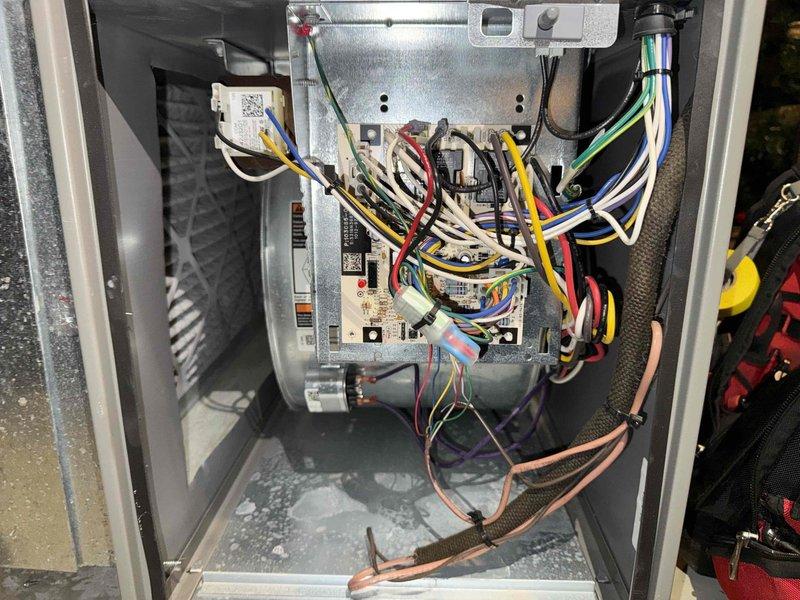 Completed MVP cooling maintenance visit on 6-year-old Lennox air conditioning system. Performed comprehensive inspection of outdoor condenser unit, removed access panel to examine internal electrical components and control board, verified proper wiring connections throughout system, and assessed condensate drainage function. Unit found operating within normal parameters with all electrical connections secure and control module functioning correctly.