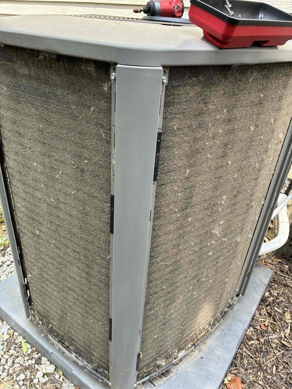 Completed MVP Cooling Visit on outdoor air conditioning condenser unit. Upon arrival, found filter panels heavily clogged with dirt, dust, and debris accumulation. Cleaned condenser coils and mesh filter panels, removing substantial buildup to restore proper airflow and system efficiency. Unit operational and running within normal parameters upon completion.