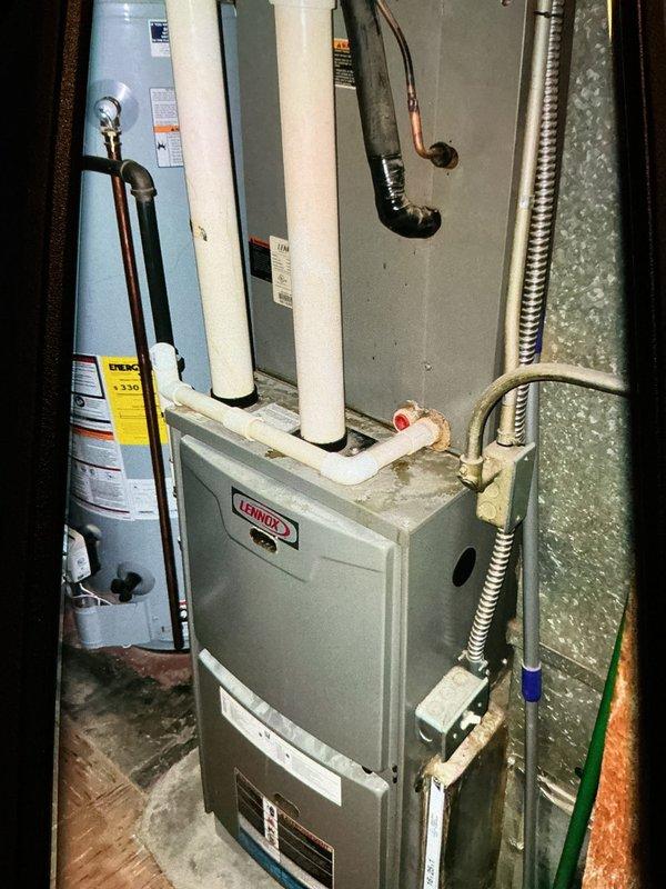 Completed scheduled MVP cooling maintenance visit on 9-year-old residential HVAC system. Performed comprehensive inspection of outdoor condensing unit, accessing electrical control panel to verify capacitor function, contactor operation, and all electrical connections. Tested system performance using diagnostic equipment, confirmed proper refrigerant pressures at service valves, and verified indoor Lennox furnace air handler operation. All components found operating within manufacturer specifications, system ready for continued service.