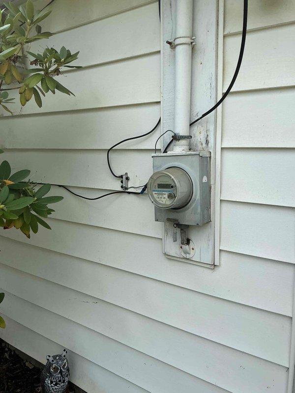 Conducted on-site assessment for home generator installation. Evaluated existing electrical service panel, meter location, and available utility infrastructure in basement mechanical room. Documented current electrical configuration including main service entrance, panel capacity, and potential transfer switch mounting locations. Assessed gas line accessibility and clearance requirements for generator placement. Photographed existing electrical meter setup on exterior wall and interior mechanical room to determine optimal integration points for automatic transfer switch and generator connection. Provided comprehensive evaluation for whole-home standby generator system installation.
