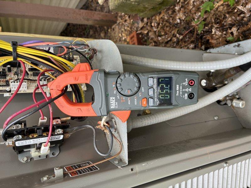 Completed MVP cooling maintenance visit on 3-year-old split system with basement air handler and outdoor heat pump unit. Performed electrical diagnostics on heat pump using clamp meter, recording 6.5 amp draw at outdoor unit while inspecting contactor, control board connections, and refrigerant lines. Accessed horizontal air handler in basement, inspected blower motor assembly, electrical connections, and condensate drainage system. All components operating within normal parameters with easy access confirmed for future service visits.