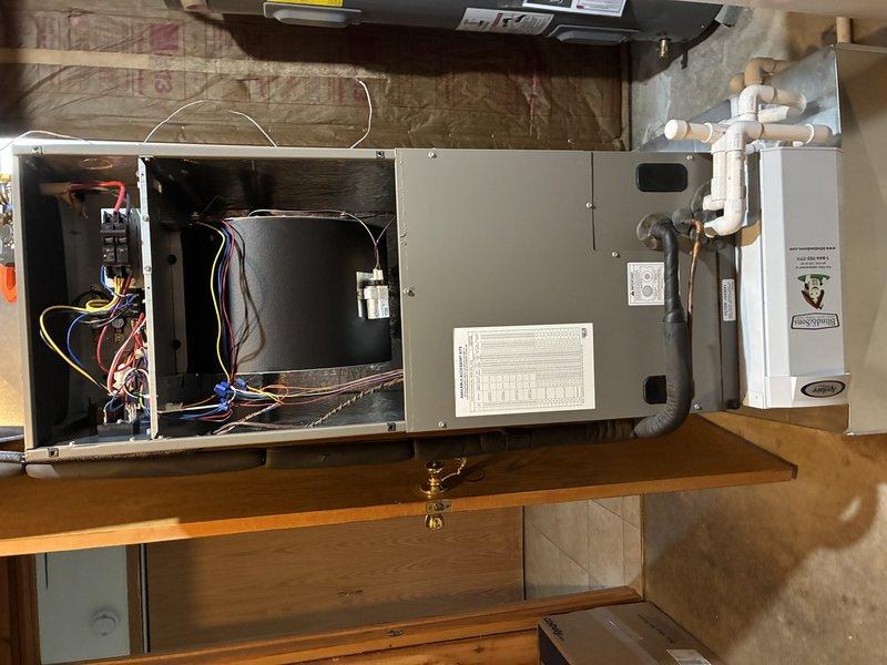 Completed MVP cooling maintenance visit on 3-year-old split system with basement air handler and outdoor heat pump unit. Performed electrical diagnostics on heat pump using clamp meter, recording 6.5 amp draw at outdoor unit while inspecting contactor, control board connections, and refrigerant lines. Accessed horizontal air handler in basement, inspected blower motor assembly, electrical connections, and condensate drainage system. All components operating within normal parameters with easy access confirmed for future service visits.