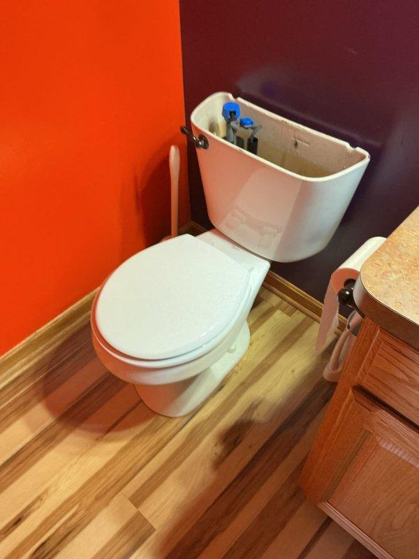 Responded to report of toilet leaking at base during flushing. Upon inspection, confirmed water seepage around toilet base and discovered severely corroded toilet flange with significant rust buildup and deterioration. Removed toilet, replaced failed wax ring seal, and installed new toilet flange assembly. Reinstalled toilet with proper sealing and verified leak-free operation through multiple flush cycles.