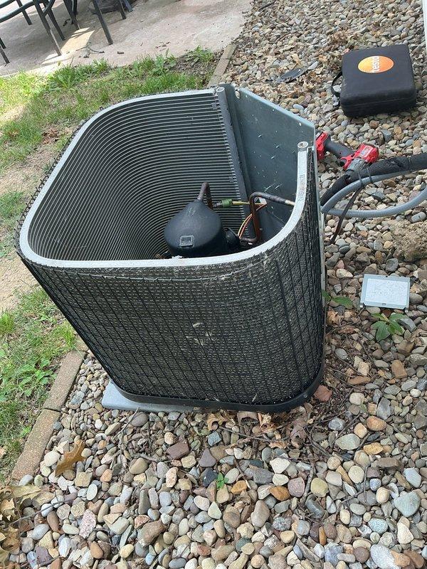 Completed preventive maintenance visit on residential cooling system. Performed system diagnostics using calibrated digital measurement equipment, recording static pressure readings of 6.25 in the attic ductwork to verify proper airflow and system performance. Inspected outdoor condenser unit with black metal housing, confirming proper installation on rock bed with adequate drainage. Verified all refrigerant line connections, service valves, and condensate management components are secure and functioning correctly. System operating within normal parameters.