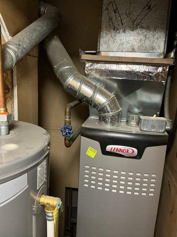 Responded to service call for minor water leaks in residential plumbing system. Inspected and repaired leaking black PVC pipe assembly in basement utility area, which had been previously wrapped with tape and secured with hose clamp. Applied proper sealing methods to eliminate leak source contributing to mold development. Examined HVAC system and ductwork in mechanical room, including Lennox furnace and water heater connections. Assessed dryer vent system for potential cleaning requirements and provided recommendations for maintenance to prevent future moisture accumulation and ensure proper ventilation.