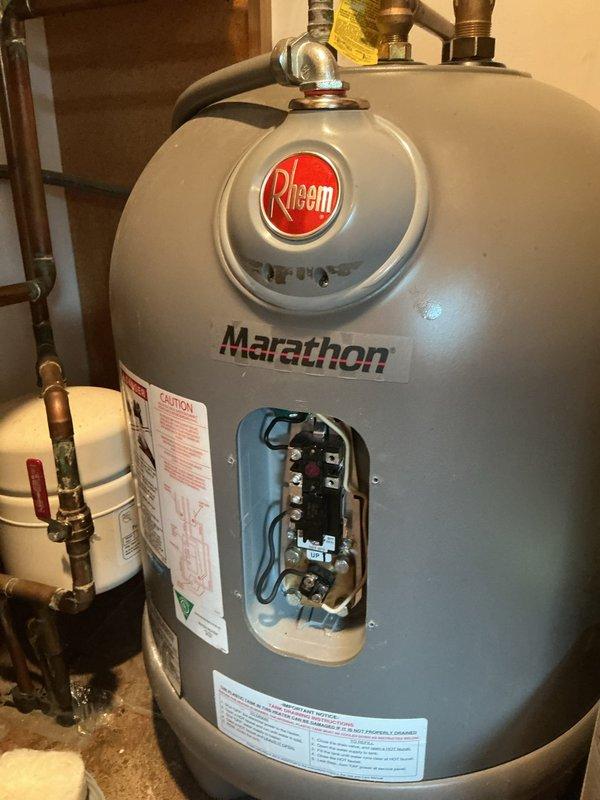 Responded to no hot water complaint on Rheem Marathon electric water heater. Upon inspection, found the thermostat reset button had tripped, indicating an electrical overload or thermostat failure. Due to the age of the heating element (4 years) and the thermostat malfunction, recommended replacement of both the thermostat and heating element to ensure reliable operation. Customer approved thermostat replacement only at this time. Collected deposit and ordered necessary parts for installation. Scheduled follow-up appointment for part installation once components arrived at shop.