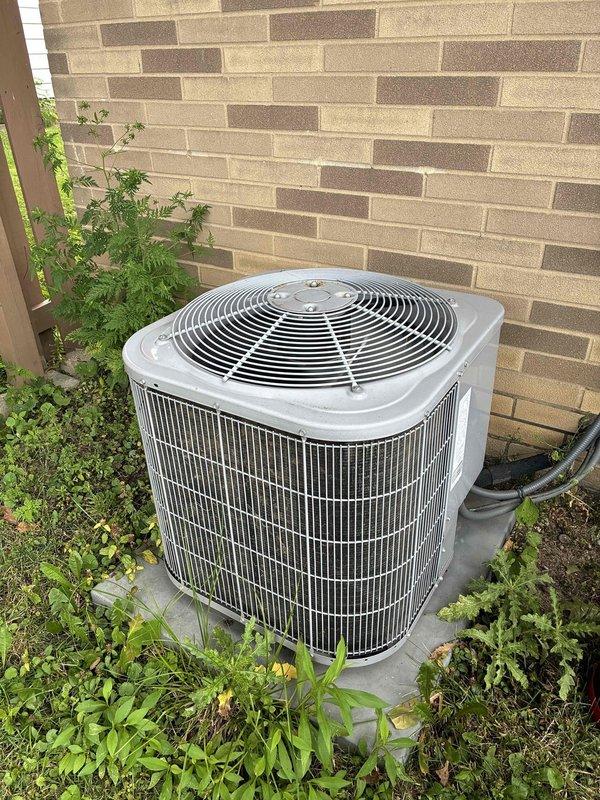 Completed scheduled MVP cooling maintenance visit on residential outdoor condensing unit. Performed comprehensive system inspection, verified proper operation of compressor and condenser fan motor, checked refrigerant levels, cleaned condenser coils, and confirmed adequate airflow through protective grilles. Unit found in good working condition with all components functioning within normal parameters.