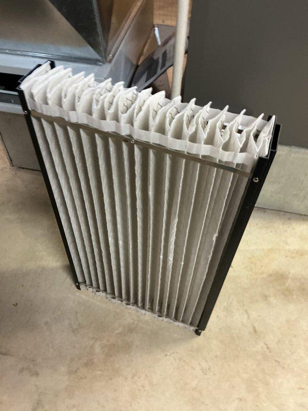 Responded to service call for loud roaring noise upon unit startup with error code 002A/A200 and blinking red light indicator. Performed diagnostic inspection of furnace system, removed and inspected air filter which showed standard pleated media condition, and accessed interior cabinet to examine blower motor assembly, wiring harnesses, control boards, and electrical connections for fault identification related to reported error code and abnormal operating sounds.