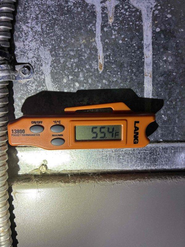 Performed seasonal tune-up on 9-year-old Lennox air conditioning system. Conducted standard maintenance inspection including temperature differential testing, which showed proper cooling performance at 52°F supply air temperature. System operating within normal parameters with no issues identified during visual inspection of outdoor condensing unit and electrical connections.