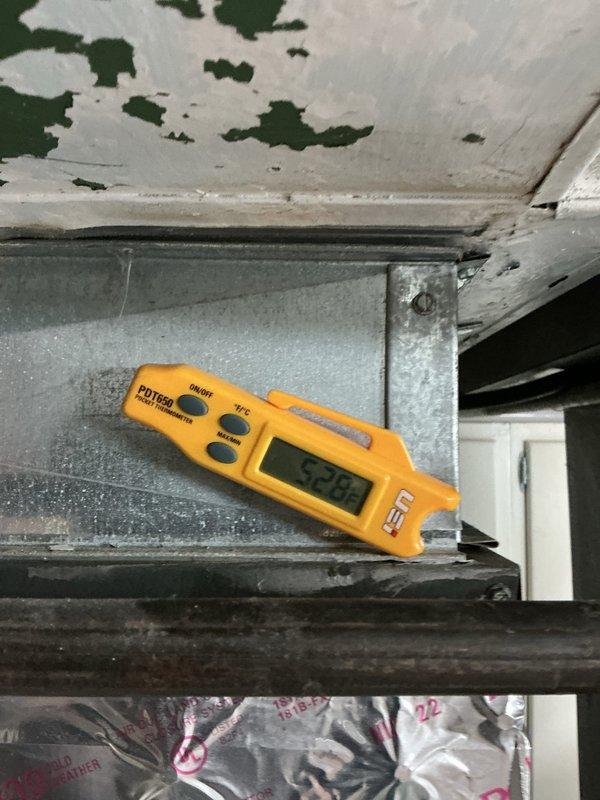 Completed scheduled cooling system maintenance visit on a 6-year-old air conditioning unit. Performed diagnostic testing using digital multimeter to measure electrical readings on motor/capacitor assembly, recording values of 42.93 and 0.020 ohms. Conducted temperature measurements in the mechanical space, documenting ambient conditions at 52.8 degrees. All critical components inspected and system found operational.
