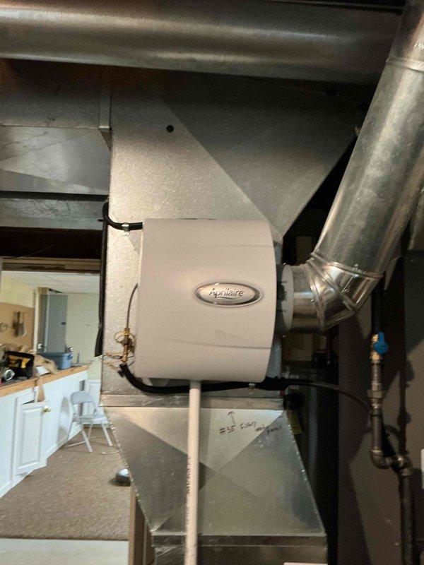 Completed BS-MVP cooling maintenance visit on 9-year-old residential air conditioning system. Performed comprehensive inspection of outdoor condensing unit and indoor components including humidifier integration with ductwork. Unit operating within normal parameters with no issues identified during service call.