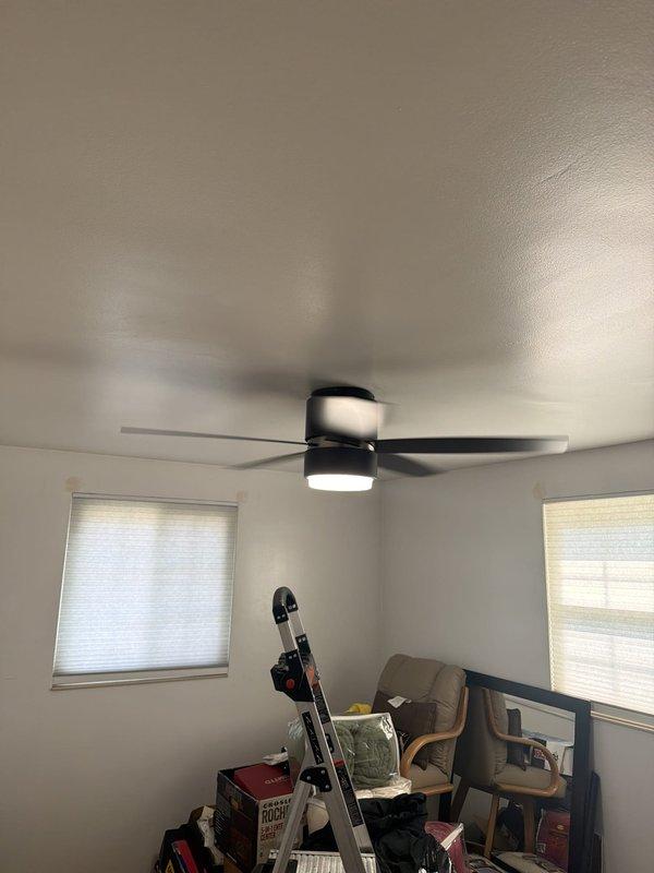 Successfully removed two existing ceiling fans and installed two customer-supplied replacement units in residential attic space and secondary room. Both installations included mounting new fan assemblies to existing electrical boxes, securing blades, and connecting integrated LED light fixtures. Verified proper operation of all fan speeds and lighting functions upon completion.
