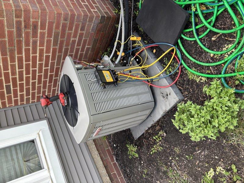 Performed scheduled MVP cooling maintenance visit on residential outdoor condensing unit. Conducted comprehensive electrical diagnostics using digital multimeter to verify system performance, tested voltage and amperage at control board and electrical connections. Inspected condenser unit components, verified proper operation of fan motor and compressor, and confirmed all electrical connections were secure within the unit's control panel.