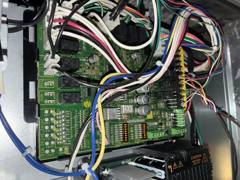 Completed scheduled MVP cooling maintenance visit on 10-year-old system. Performed comprehensive inspection of control board assembly, verifying proper operation of all electronic components, relays, and wiring connections. Inspected blower wheel and housing, noting minor dust accumulation on base pan. All electrical connections secure, circuit boards functioning within normal parameters, and blower assembly operating properly. System tested and confirmed operational.