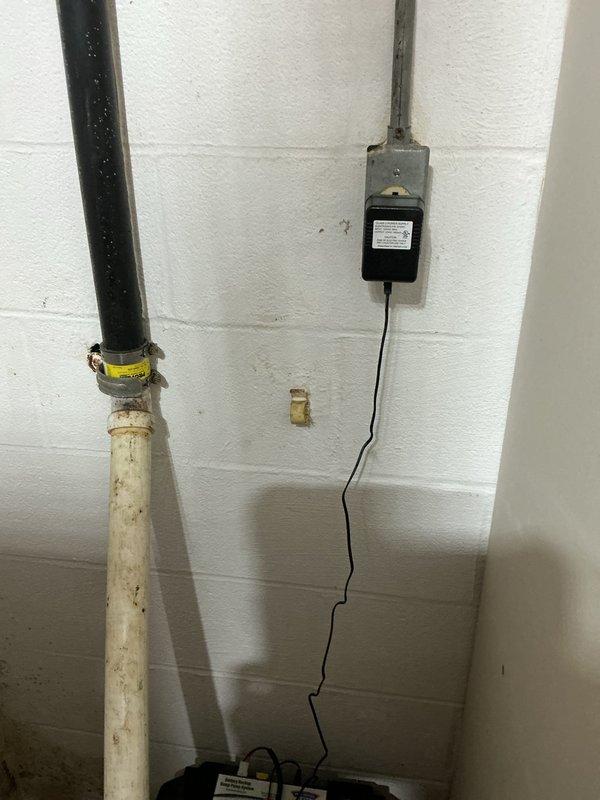 Replaced two 10-year-old sump pumps in the basement with new Level 1 all-in-one battery backup systems. The first unit was located in the utility room in the middle of the basement, and the second was positioned in the northeast corner of the basement. Both existing pumps had bolted crock lids which were removed during the replacement process. Successfully installed both new battery backup sump pump systems, ensuring proper operation and backup power capability for continued basement protection against water intrusion.