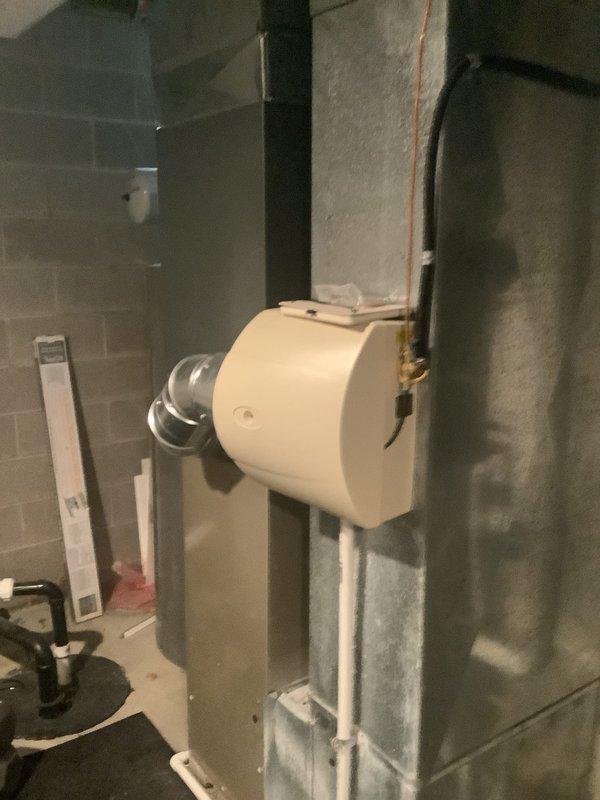 Completed furnace replacement estimate for 21-year-old heating system. Documented existing installation including furnace unit, water heater, ductwork configuration, humidifier integration, and copper piping layout in basement utility space. Photographed current equipment conditions and mechanical room setup to provide comprehensive assessment for system replacement recommendations.