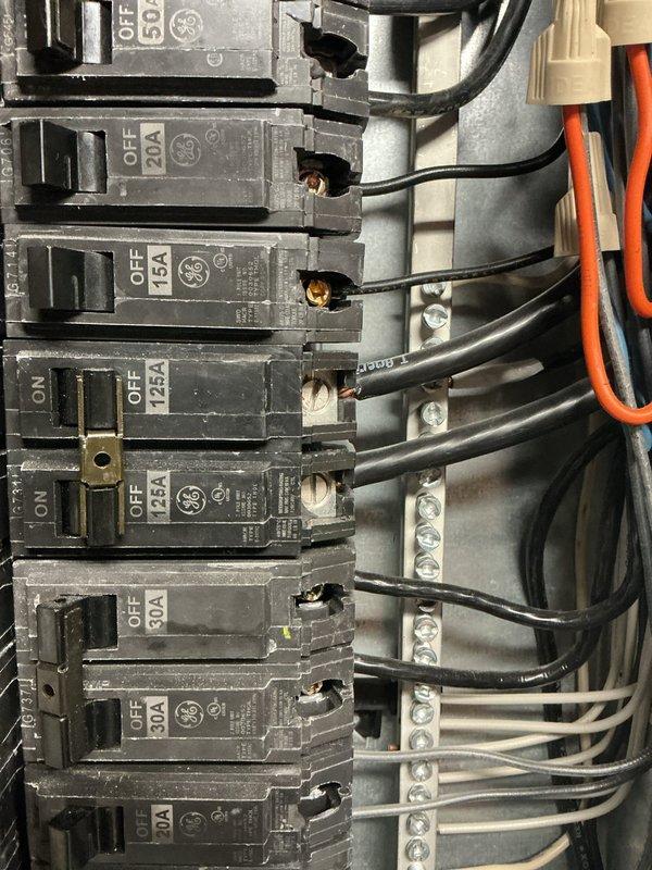 Installed electrical panel and wiring for air handler unit with two dedicated 20-amp circuits to provide temporary cooling capability. Ran conduit from new panel box, terminated all circuit wiring to breakers and neutral bus bar, and verified proper electrical connections for safe operation pending final inspection confirmation.