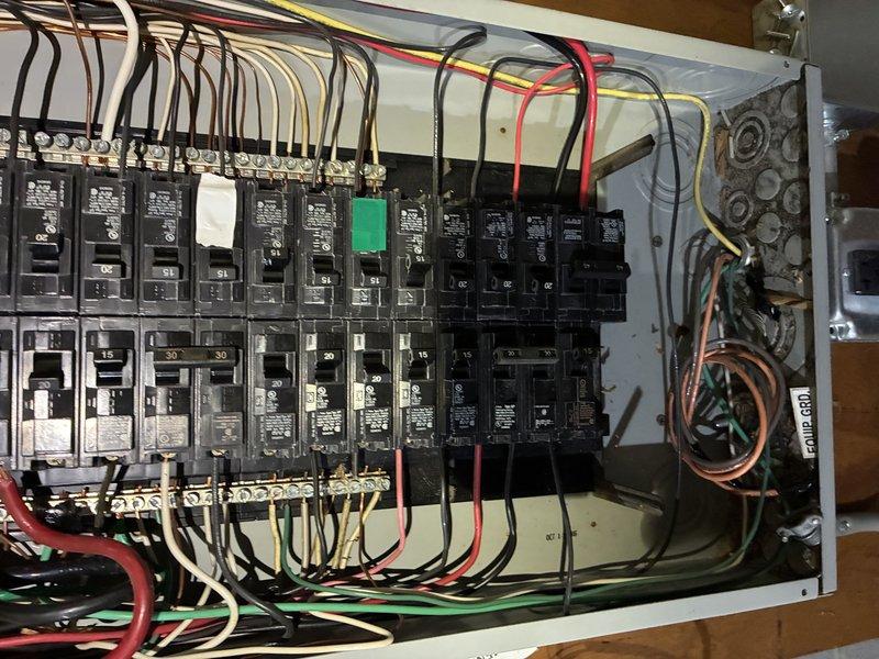 Replaced outdated cloth-wired stovetop circuit with new four-wire configuration (two hots, neutral, and ground) to meet current code requirements for new appliance installation. Ran new circuit from main electrical panel through crawl space to countertop location, installed junction box in cabinet with breaker lock at panel, and properly capped existing circuit in approved junction box. Repaired open splice above panel to eliminate safety hazard.