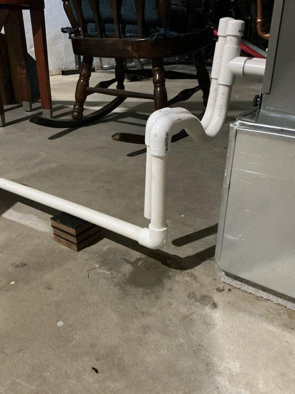 Completed installation of new A.O. Smith tanked water heater in basement utility area. Drained and removed old water heater from premises per customer request. Repaired leaking elbow joint on blower condensate line running to sump pump. All plumbing connections tested and verified operational with no leaks detected.