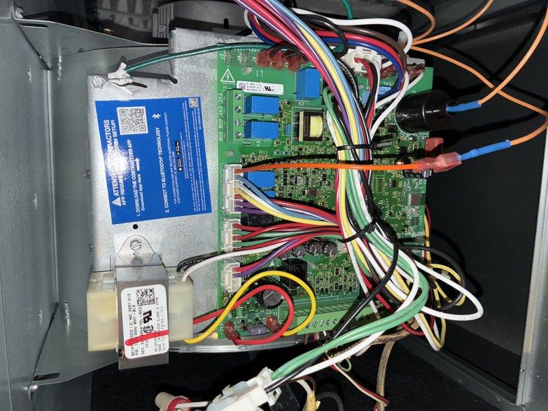 Completed routine HVAC maintenance visit for cooling system, performing comprehensive inspection of control board assembly and electrical components. Inspected multi-zone control panel housing containing three circuit boards with associated wiring harnesses, verified proper connections and component integrity, and examined fuse assembly to ensure electrical protection systems were functioning correctly within manufacturer specifications.