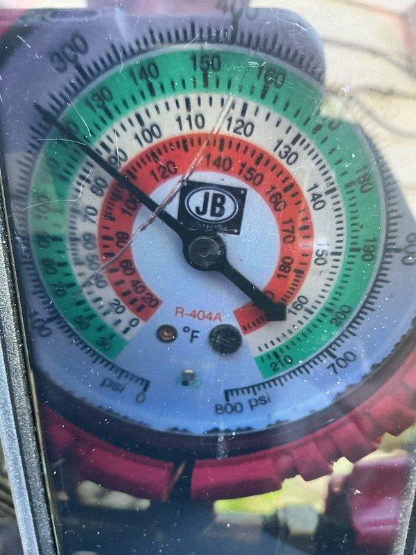 Responded to service call for 2-year-old air conditioning system experiencing continuous operation and refrigerant line freezing. Upon inspection, measured system pressures using manifold gauges and identified low refrigerant charge causing evaporator coil to ice over. Accessed air handler unit, confirmed frozen evaporator coil and condensate drainage system functionality. Applied appropriate cleaning solution to affected components and allowed system to thaw completely before further diagnostics.