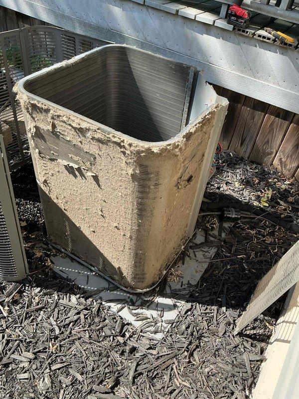 Responded to service call for water leak on 10-year-old air conditioning system. Upon arrival, performed visual inspection of outdoor condenser unit, which showed significant exterior corrosion and deterioration of cabinet panels. Noted heavy accumulation of dirt, debris, and organic matter around unit perimeter and against adjacent fence line.

Opened access panel to inspect interior components and evaporator coil assembly. Found compressor and internal components operational but surrounded by accumulated debris on base pan. Inspected evaporator coil and identified restricted airflow due to dirt buildup on aluminum fins. Examined condensate drain system and located clog in drain line causing water backup and overflow.

Cleared condensate drain line obstruction using appropriate tools and verified proper drainage flow. Cleaned debris from base pan and surrounding areas. Tested system operation to confirm water now draining properly through condensate line without leakage. Documented eq