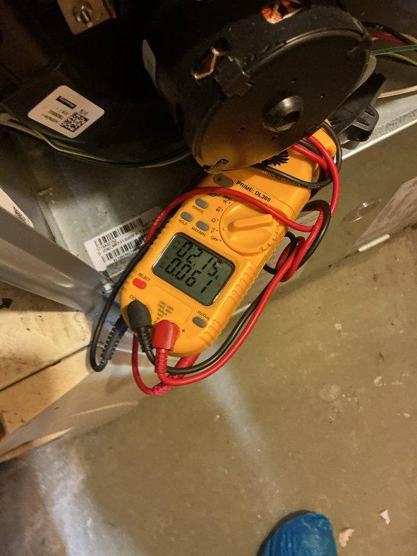 Completed scheduled cooling maintenance visit on residential HVAC system. Performed temperature diagnostics in conditioned space, recording 93°F ambient reading in basement area. Conducted electrical measurements and system performance verification at outdoor condensing unit, checking voltage and amperage readings to ensure proper compressor operation and confirm system is running within manufacturer specifications.