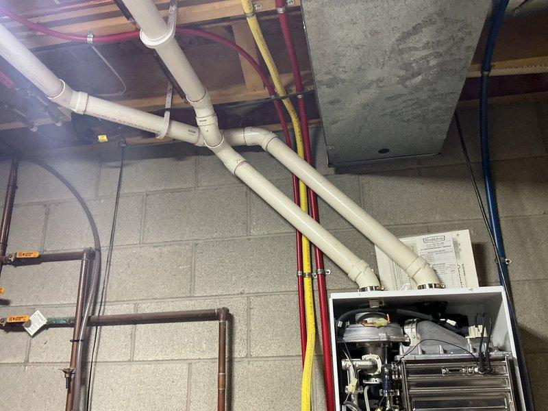Performed descaling maintenance on a 12-year-old tankless water heater unit. Flushed the heat exchanger with descaling solution to remove mineral buildup and restore optimal heating efficiency, completing the preventative maintenance service as requested.
