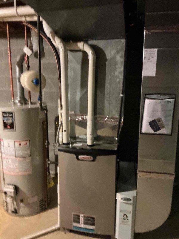 Completed scheduled MVP cooling maintenance visit on residential HVAC system located in basement mechanical room. Performed comprehensive inspection of furnace unit with air handler, verified proper operation of cooling components, and checked refrigerant lines running to outdoor condenser. Inspected all ductwork connections, PVC condensate drain lines, and associated plumbing components to ensure system readiness for cooling season. All equipment found operating within normal parameters with no issues identified.