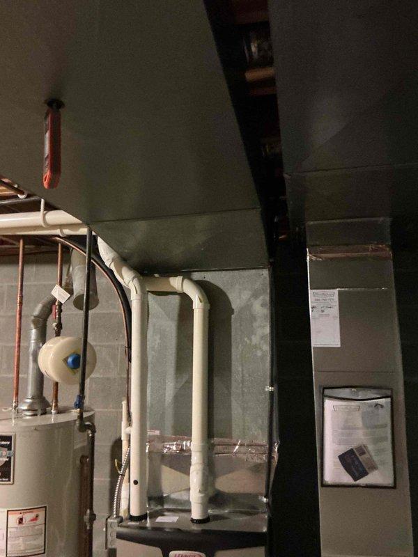 Completed scheduled MVP cooling maintenance visit on residential HVAC system located in basement mechanical room. Performed comprehensive inspection of furnace unit with air handler, verified proper operation of cooling components, and checked refrigerant lines running to outdoor condenser. Inspected all ductwork connections, PVC condensate drain lines, and associated plumbing components to ensure system readiness for cooling season. All equipment found operating within normal parameters with no issues identified.