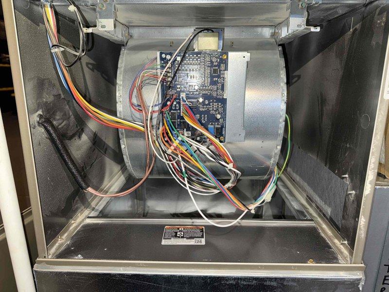 Completed scheduled BS-MVP cooling maintenance visit on 4-year-old air conditioning system. Performed comprehensive inspection of blower motor assembly and associated control electronics, verifying proper operation of motor, capacitor connections, and control board functionality. Inspected air filter and documented moderate dust accumulation; filter shows normal wear pattern for service interval with visible dirt and debris collection across fibrous material, indicating adequate airflow filtration. All electrical connections, wire harnesses, and low-voltage control wiring examined and found secure with no signs of overheating or damage. System operating within normal parameters at time of service.