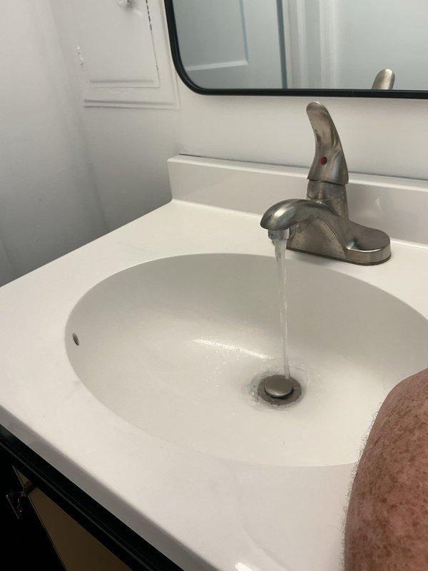 Responded to a service call for a first-floor bathroom sink requiring shut-off valve replacement. Successfully installed two new shut-off valves on the hot and cold water supply lines beneath the vanity, restoring proper water control functionality to the fixture. The existing copper supply lines and PVC drain assembly were inspected and confirmed to be in working order upon completion.